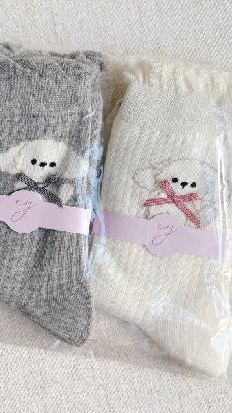 Bichon_Puppy_Design_Socks. Set of 2: one in gray and one in ivory.