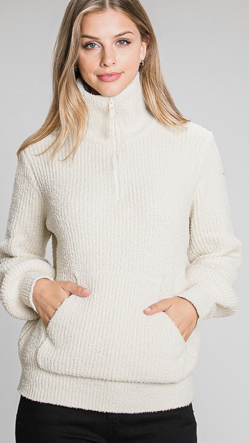 model wearing the Luna Plush Pullover Zip turtleNeck Sweater with Kanga Pockets in color cream by www.thehouseofblondie.com
