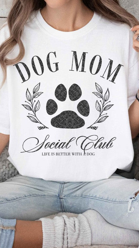 White colored Graphic short-sleeved T-shirt on a model that reads "Dog Mom Socal Club".